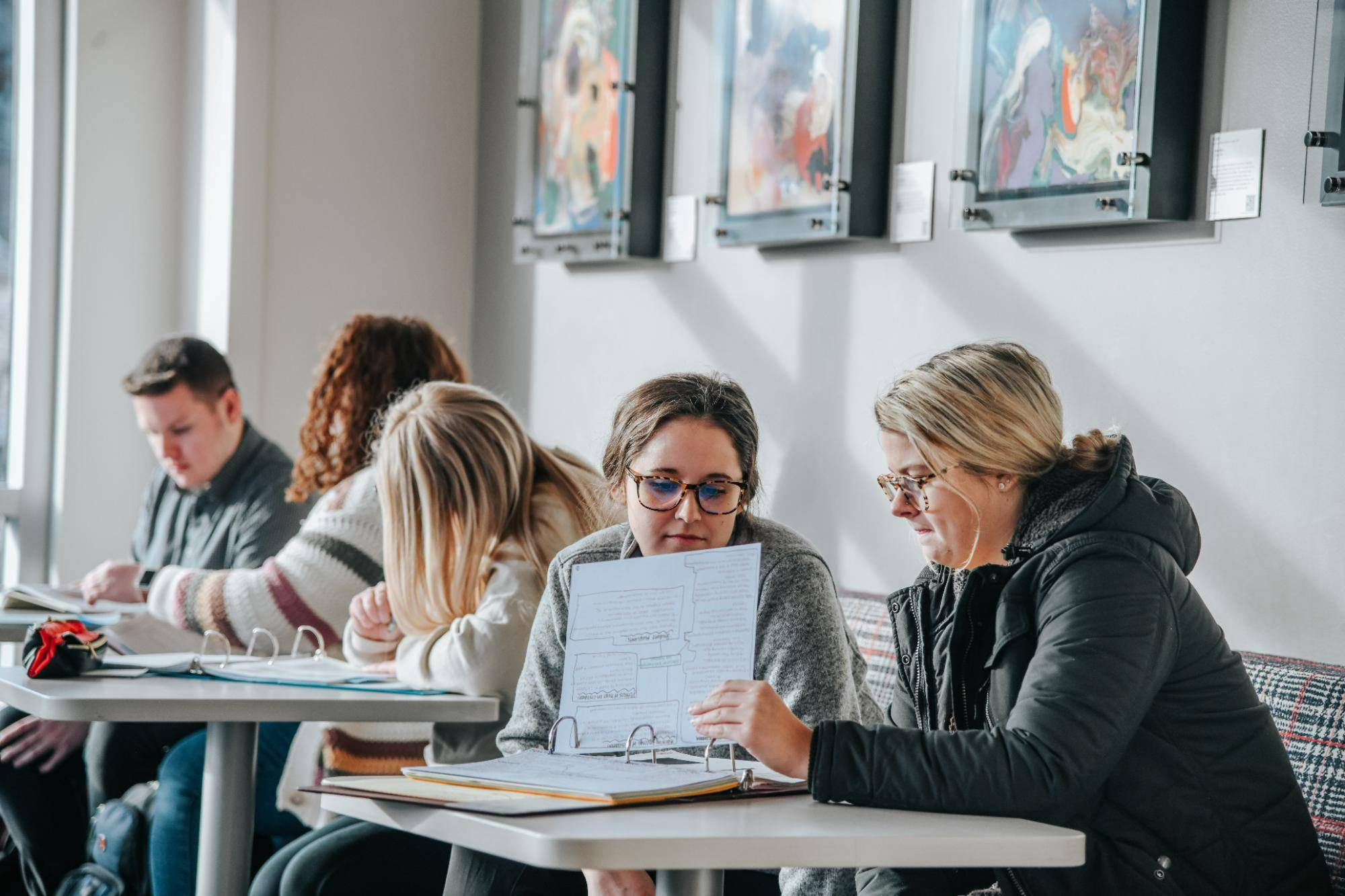 Students studying at a table